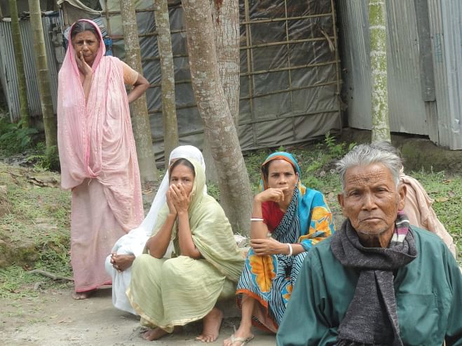 Worried faces of a Hindu family of Bawra village in Patgram upazila of Lalmonirhat. Can they cast their votes peacefully today? PHOTO: STAR