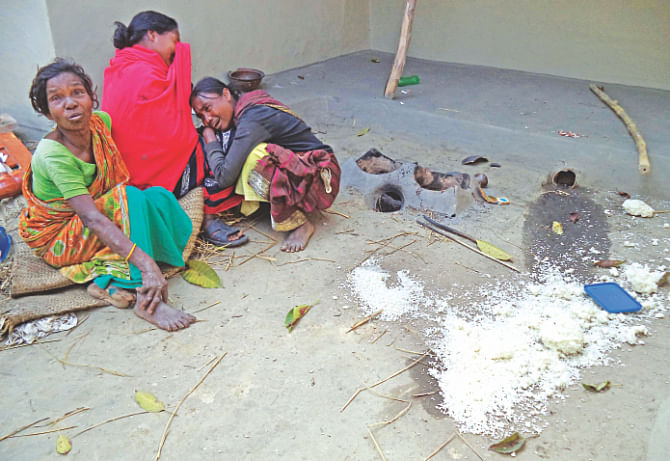 Women in tears after Bangalees vandalised and looted their homes. Photo: Star