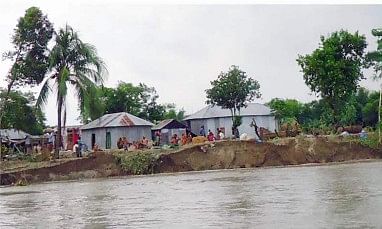 The River Jamuna turned furious during the recent flooding and devoured hundreds of homesteads in Manikganj district. The photo was taken from Charkatari village in Daulatpur upazila a few days ago. PHOTO: STAR