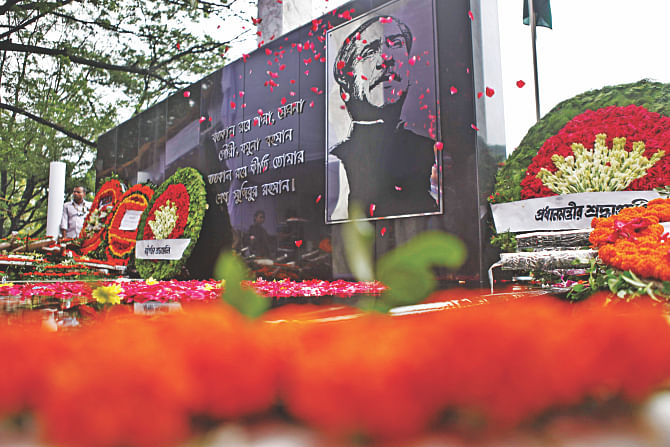 Floral wreaths placed by the president, the prime minister and socio-political leaders and organisations at the mural of Bangabandhu Sheikh Mujibur Rahman opposite to the historic Dhanmondi-32 house on the occasion of National Mourning Day yesterday. Photo: Rashed Shumon 
