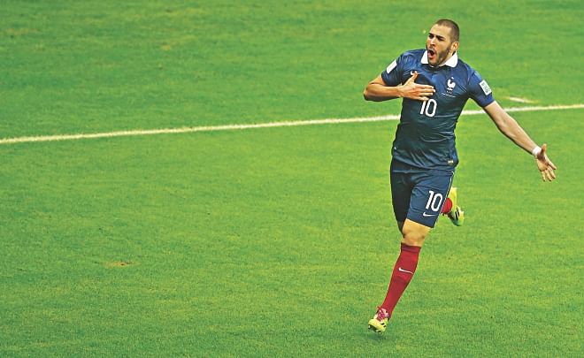 France forward Karim Benzema celebrates after scoring his second goal during their 3-0 victory over Honduras in the World Cup Group E match at the Beira Rio stadium in Porto Alegre yesterday.  PHOTO: REUTERS 