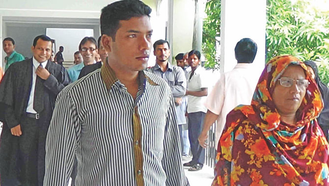 Limon at a Jhalakathi court alongside his mother yesterday. He does not have any cases against him now but he is unhappy that the people who maimed him have not yet been brought to book. Photo: Star