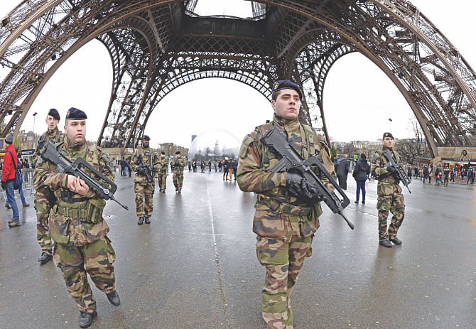 French soldiers patrol in front of the Eiffel Tower in Paris yesterday. Photo: AFP