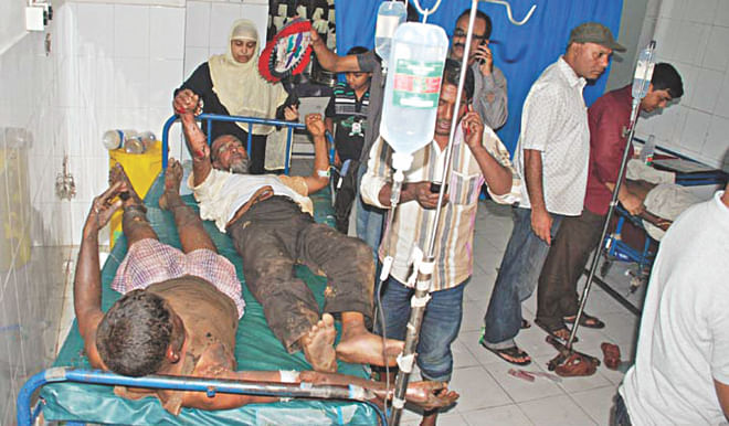 Injured workers being treated at the emergency section of the burn unit of Chittagong Medical College Hospital last night. They were wounded in an explosion at a fuel depot. Photo: Star