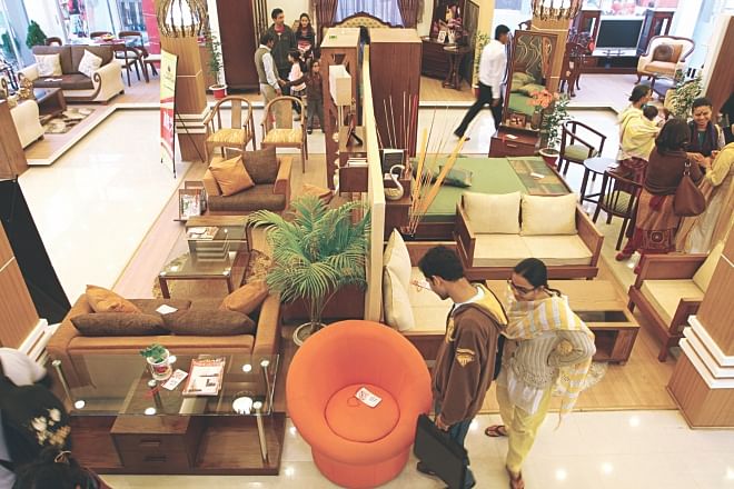 Visitors check out furniture at Partex Pavilion at Dhaka International Trade Fair in the city.  Photo: Prabir Das
