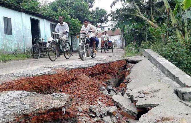 Vehicles ply the 32-kilometre stretch of Gaibandha-Saghata Road amid risk of accident as cracks, potholes and ditches have developed at several points of it. Photos show a subsided portion of the road near Bonarpara Bazar and numerous cracks and potholes in Saghata area as asphalt got eroded.  Photo: Star