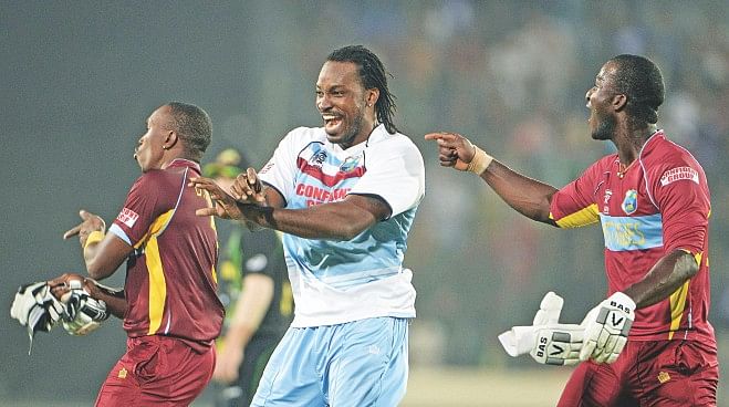 Gangnam is back for the Caribbeans. Here an excited Chris Gayle (C) entertains his captain Darren Sammy and Dwayne Bravo who have just completed a superb chase against Australia during a crucial Super 10s game of the ICC World T20 at Mirpur yesterday. PHOTO: AFP