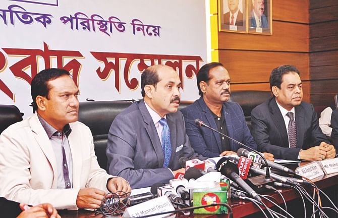 Second from left, Atiqul Islam, president of Bangladesh Garment Manufacturers and Exporters Association, speaks to the media at a briefing at the BGMEA headquarters in Dhaka yesterday.  Photo: BGMEA