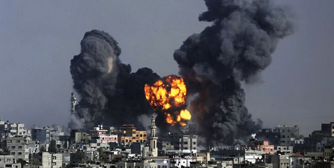 Caption: Gaza city: Smoke and fire from the explosion of an Israeli strike rise over Gaza City on Tuesday as Israeli airstrikes pummelled a wide range of locations along the coastal area and diplomatic efforts intensified to end the two-week war. Photo: AP