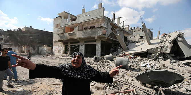 A Palestinian woman reacts as she stands around destroyed houses in the Shejaia neighbourhood, which witnesses said was heavily hit by Israeli shelling and air strikes during an Israeli offensive, in Gaza City July 26. A 12-hour humanitarian truce went into effect on Saturday after Israel and Palestinian militant groups in the Gaza Strip agreed to a UN request for a pause in fighting and efforts proceeded to secure a long-term ceasefire moved ahead. Photo: Reuters