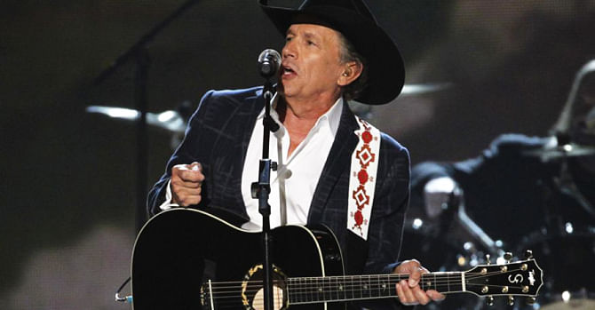 This April 6 photo shows George Strait performing 'I Got a Car' at the 49th Annual Academy of Country Music Awards in Las Vegas, Nevada. Photo: Reuters