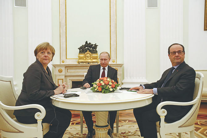German Chancellor Angela Merkel (L), French President Francois Hollande (R) and Russia's President Vladimir Putin attend a meeting on resolving the Ukraine crisis, at the Kremlin in Moscow on Friday.  Photo: AFP