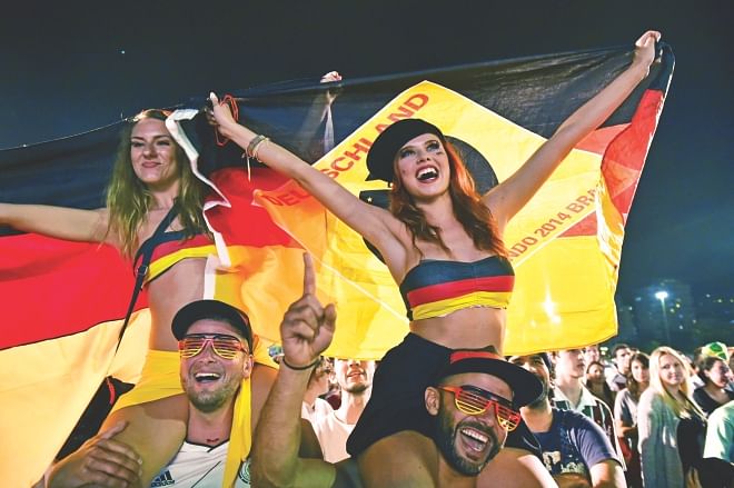 German fans enjoy their time as they watch the World Cup Round of 16 match between Germany and Algeria in Rio de Janeiro on Monday. PHOTO: AFP