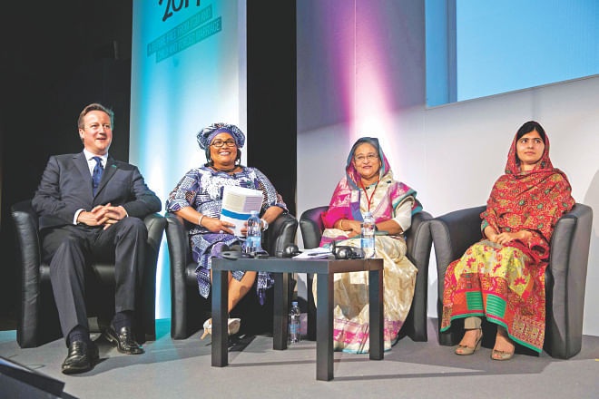 Prime Minister Sheikh Hasina sits with British Prime Minister David Cameron, left, Chantal Compaore the First Lady of Burkina Faso, and Pakistani rights activist Malala Yousafzai, right, at the “Girl Summit 2014” at Walworth Academy in London yesterday.  PHOTO: AFP 