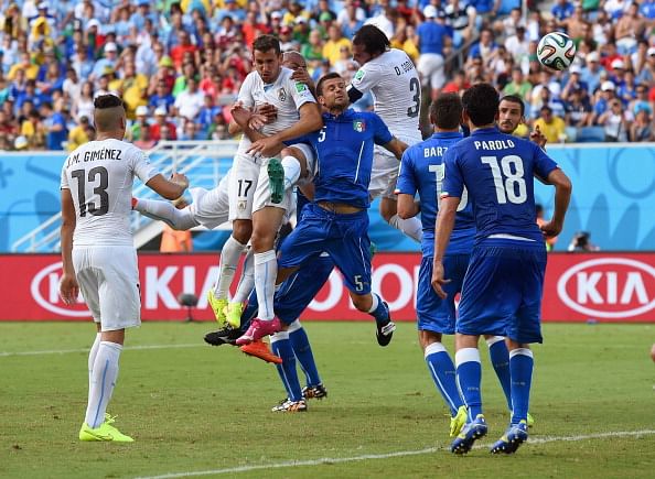 Diego Godin of Uruguay goes up for a header and scores his team's first goal during the 2014 FIFA World Cup Brazil Group D match between Italy and Uruguay at Estadio das Dunas on June 24, 2014 in Natal, Brazil. Photo: Getty Images