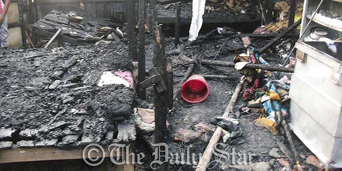 Fire breaks out at a house in Gopalganj Sadar upazila Sunday morning killing four people on the spot. Photo: Star