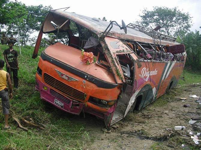 The wreckage of the bus that plunged into a roadside ditch on Dhaka-Khulna highway in Kashiani upazila of Gopalganj Saturday. Photo: STAR