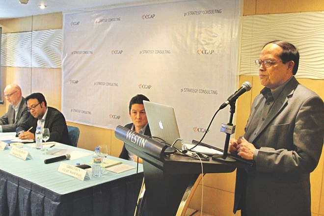 Atiur Rahman, governor of Bangladesh Bank, speaks at the launch of a mobile financial service survey conducted by pi Strategy Consulting in partnership with the World Bank's Consultative Group to Assist the Poor, at the Westin in Dhaka yesterday. Photo: Star 
