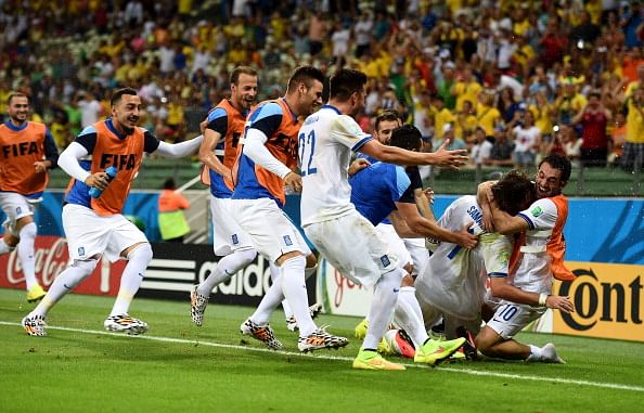 Giorgos Samaras of Greece celebrates with teammates after scoring his team's second goal on a penalty kick during the 2014 FIFA World Cup Brazil Group C match between Greece and the Ivory Coast at Castelao on June 24, 2014 in Fortaleza, Brazil. Photo: Getty Images