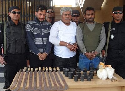 Rab-5 arrested 3 people and seized gunpowder, bombs and other weapons in Chapainawabganj on Wednesday. PHOTO: STAR