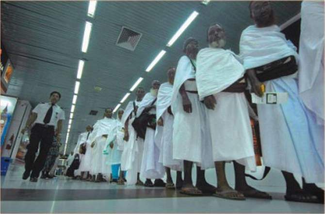 In this September 29, 2011 photo, hajj pilgrims are crossing the boarding bridge at Hazrat Shahjalal International Airport. Biman Bangladesh Airlines carried 505 pilgrims to Saudi Arabia on its first hajj flight this year.