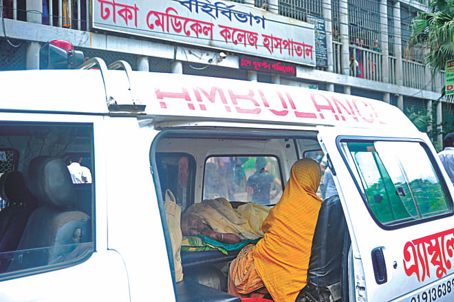 An elderly patient from Manikganj waits inside an ambulance before the outdoor section of DMCH as a doctors' strike sends services into a nosedive. Photo: Firoz Ahmed