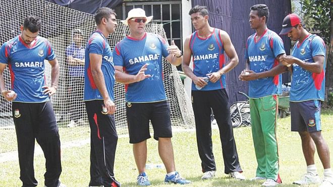 Bangladesh's new bowling coach Heath Streak (3rd from L) conducts his first session with the pace bowlers at the Sher-e-Bangla National Stadium in Mirpur yesterday. PHOTO: STAR