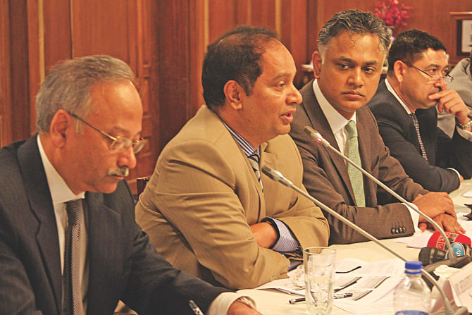 Second from left, Hedayetullah Al Mamoon, senior secretary of the commerce ministry, speaks at a discussion on the rules of origin organised by the MCCI and BFTI in Dhaka yesterday. Syed Nasim Manzur, president of MCCI, was also present.  Photo: Star