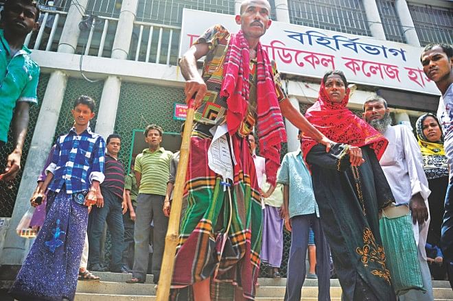 Patients and their attendants are left helpless as the outdoor services of Dhaka Medical College Hospital remain suspended yesterday during a strike by interns and honorary doctors at the largest public hospital in the country. Photo: Firoz Ahmed