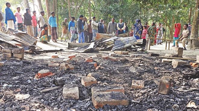 The grocery store of a Hindu man was reduced to ashes near the Sarbojanin Kali Mandir at Kamalapur village in Narail sadar upazila after unidentified miscreants carried out an arson attack somewhen between late Friday and early yesterday. The victim, Mrittunjay Biswas, said there were goods worth over Tk 1 lakh, and the shop was the only means of his income. Narail District Council Administrator Subhash Bose said more than 80 percent of voters from this Hindu-populated village cast their ballots in the January 5 national elections. Police started patrolling the area to protect them against any future violence. Photo: Ponuel S Bose