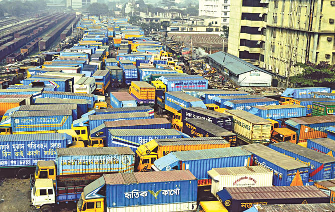 Cargo vans lie idle at the truck stand in the capital's Tejgaon yesterday due to the 48-hour hartal and an indefinite blockade enforced by the BNP-led 20-party alliance in Dhaka and Khulna divisions. Road transport has become the most affected sector by the return of blockades, shutdowns, arson, and bomb attacks since early this month, making a heavy dent on the country's economy, and raining unfathomable miseries on its people.  Photo: Banglar Chokh