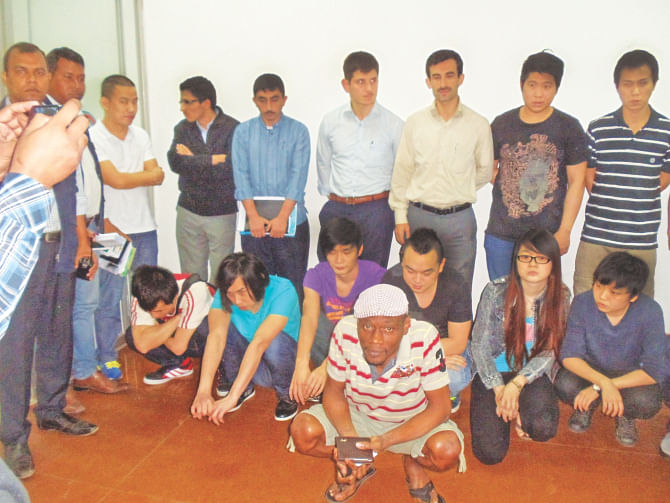 The 16 foreigners at Shahjalal International Airport on Tuesday before they were deported. They had been staying in Bangladesh illegally. Photo: courtesy