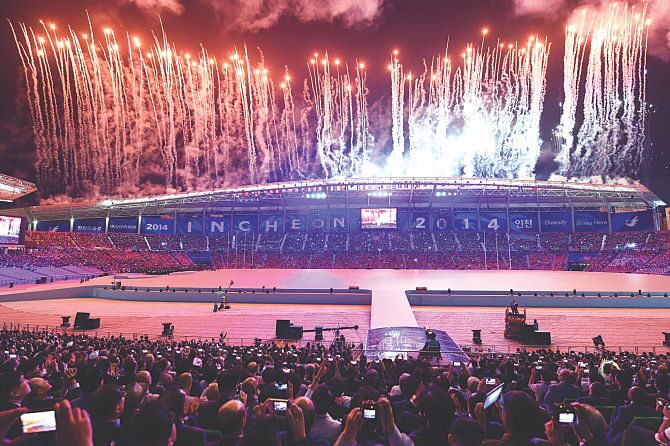 ASIAN GAMES... Fireworks light up the night sky above the Incheon Asiad Stadium during the opening ceremony of the 17th Asian Games in Incheon yesterday. The colourful opening ceremony kicked off 15 days of competition among 9,500 athletes from 45 countries of Asia.  Photo: AFP