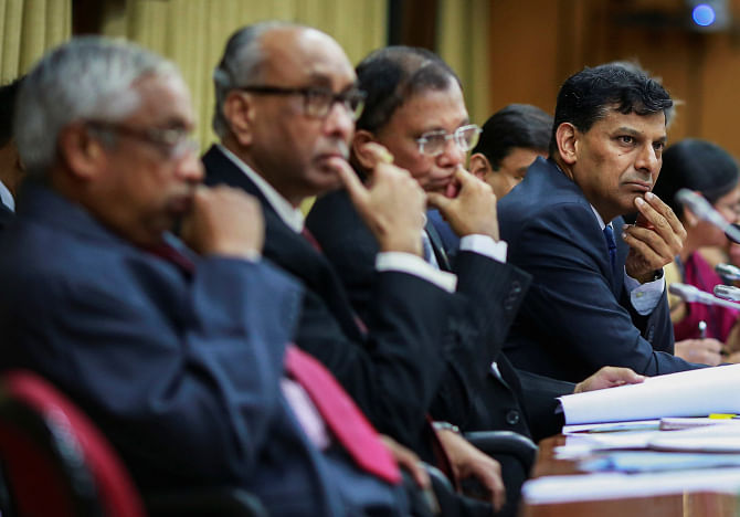 The Reserve Bank of India Governor Raghuram Rajan and other officials listen to a question during a news conference after the bi-monthly monetary policy review in Mumbai yesterday. Photo: REUTERS 