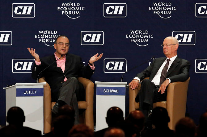 Left, India's Finance Minister Arun Jaitley speaks as World Economic Forum founder and executive chairman Klaus Schwab watches during the India Economic Summit 2014 at the World Economic Forum in New Delhi on November 5. Photo: REUTERS 