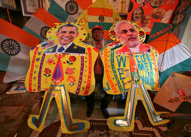 Kite-maker Jagmohan Kanojia displays kites, with portraits of Indian Prime Minister Narendra Modi, right, and US President Barack Obama, ahead of Obama's visit, in the northern Indian city of Amritsar yesterday. Photo: Reuters