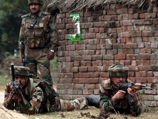 Indian soldiers are seen at their positions following an attack by militants at the Pindi Khattar belt of the Arnia border sector, some 45 kms from Jammu district, yesterday.  Photo: AFP