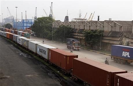 Shipping containers roll out of a port on the Bay of Bengal which forms the northeastern part of the Indian Ocean, in Chennai, India, Friday, Sept. 19, 2014. Photo: AP