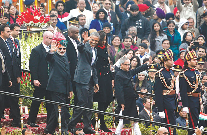 Indian Prime Minister Narendra Modi, US President Barack Obama and Indian President Pranab Mukherjee wave to spectators during India's Republic Day parade on Rajpath in New Delhi yesterday.  Photo: AFP