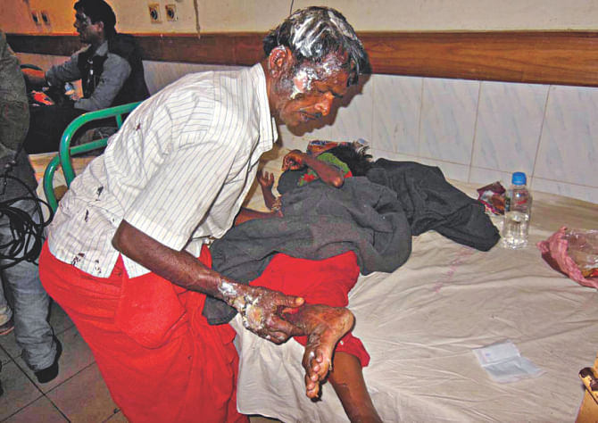 Injured Tara trying to help his daughter at RMCH yesterday noon. He was unaware that his son had already died. Photo: Star