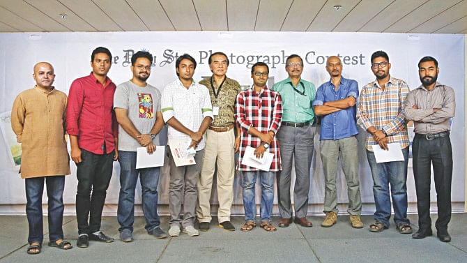 Winners and finalists of The Daily Star photo contest 'inPixel' with the 'inPixel' team in a prize giving ceremony held at The Daily Star Centre in the capital yesterday.  Photo: Star