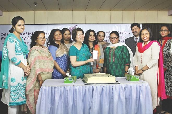 Fifth from left, Rokia Afzal Rahman, president of Metropolitan Chamber of Commerce and Industry, and Rashed Maqsood, managing director of Citibank, attend a programme to mark International Women's Day by launching an android app for women, at The Daily Star Centre yesterday.  Photo: Star 