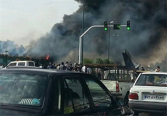 A plane crash in Tehran, Iran's capital city on Sunday morning August 10, 2014. 40 people reported dead so far. Photo Credit: Abas Aslani (@abasinfo) 