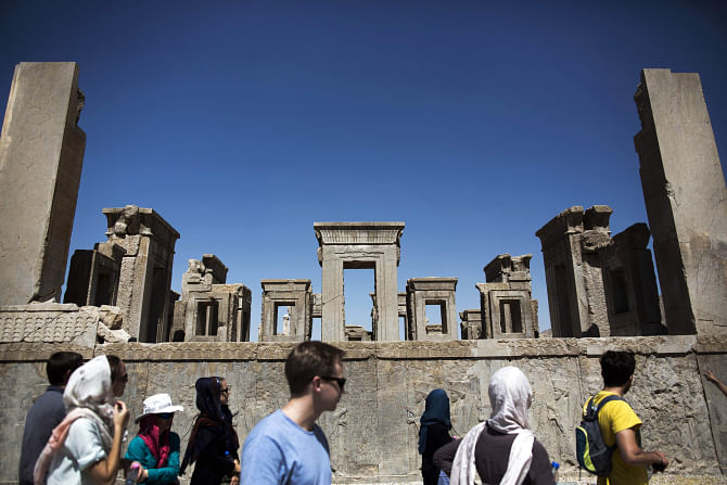 European and Iranian tourists visit the Tachara Palace also known as the palace of King Darius of Achaemenid (522-486 BC) at the ancient Persian city of Persepolis near Shiraz in southern Iran. Photo: AFP