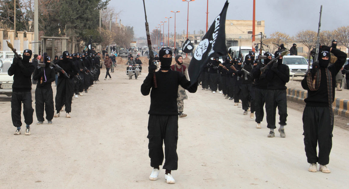 Islamic State militants march on the roads somewhere in Syria. File photo