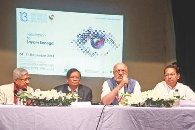An animated Benegal (2-R) responds to a question from the audience.
