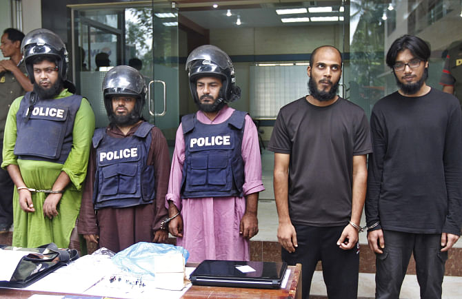 Five suspected militants, including sons of a senior bureaucrat and a former judge, are produced before journalists yesterday, a day after detectives detained them in the capital. Photo: Star