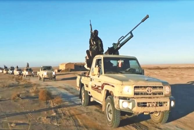 An image grab taken from a propaganda video uploaded yesterday by the Islamic State of Iraq and the Levant allegedly shows militants driving at an undisclosed location in Iraq's Nineveh province. Photo: AFP