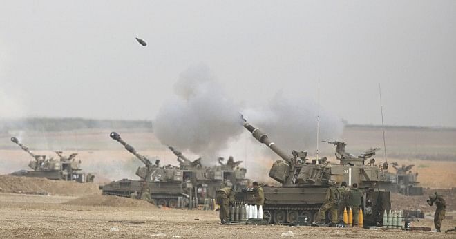 An Israeli artillery fires a 155mm shell towards targets in the Gaza Strip. Photo: AFP