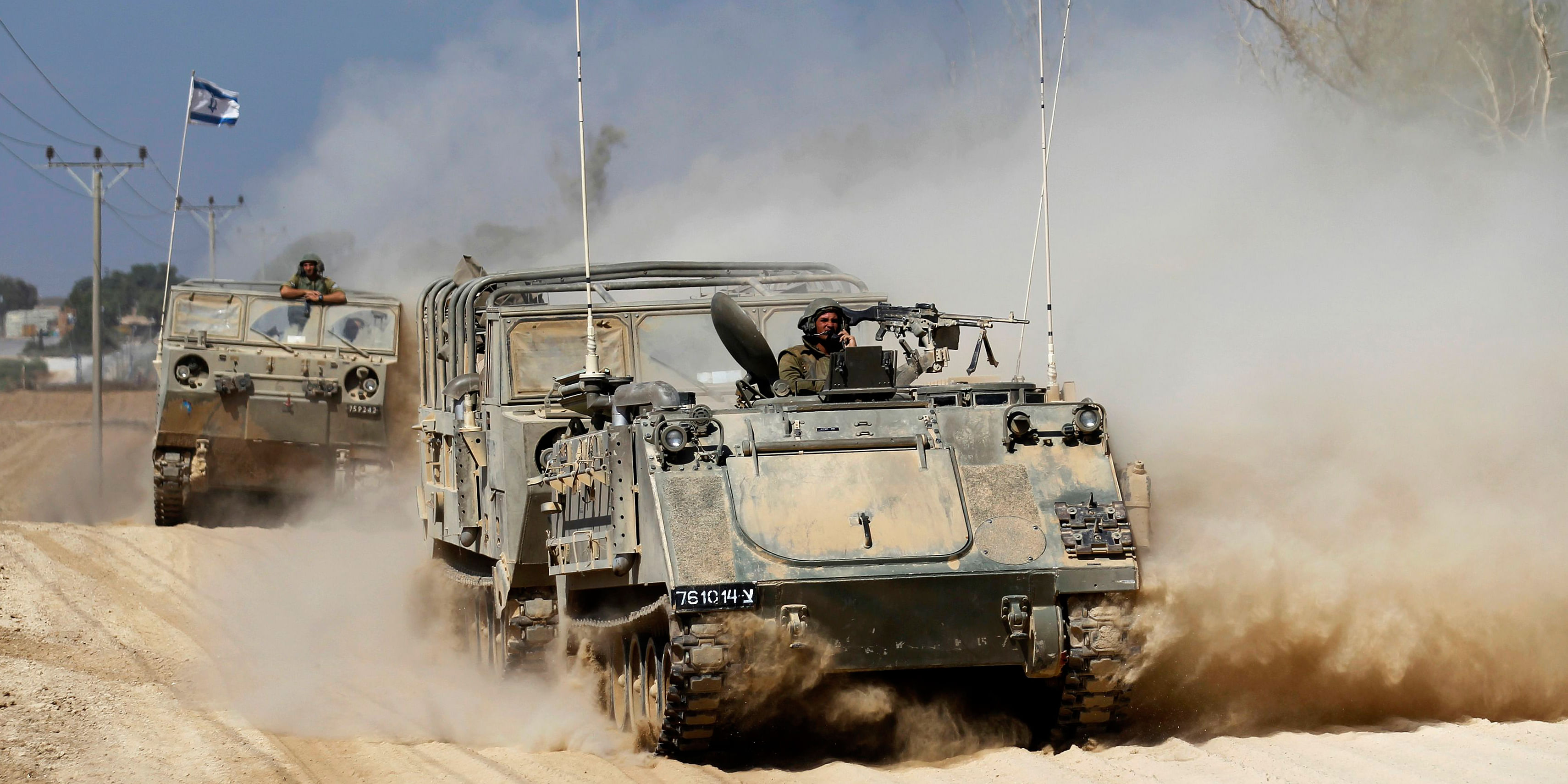 An Israeli armoured personnel carrier (APC) manoeuvres near the border with Gaza Strip August 22. A mortar bomb fired from Gaza killed a four-year-old Israeli boy, in a border collective farm on Friday, Israeli security sources said, the first Israeli child killed in the conflict. Photo: Reuters